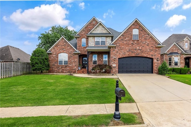 5503 S Turnberry Rd, Rogers, AR 72758 - view of front of home featuring an attached garage, driveway, and brick siding