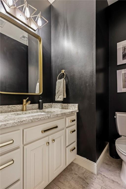 5503 S Turnberry Rd, Rogers, AR 72758 - bathroom featuring vanity and wood finished floors