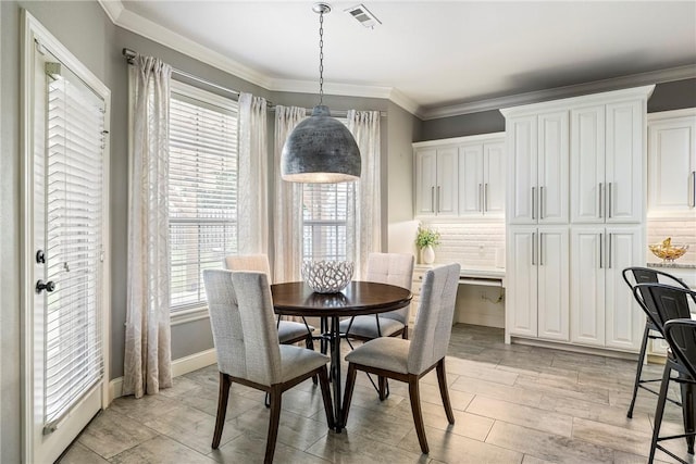 5503 S Turnberry Rd, Rogers, AR 72758 - dining area featuring crown molding and baseboards