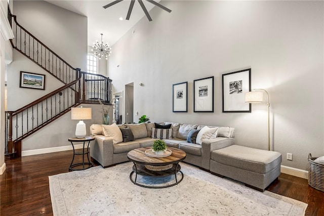 5503 S Turnberry Rd, Rogers, AR 72758 - living area featuring a ceiling fan, stairway, wood finished floors, high vaulted ceiling, and a chandelier