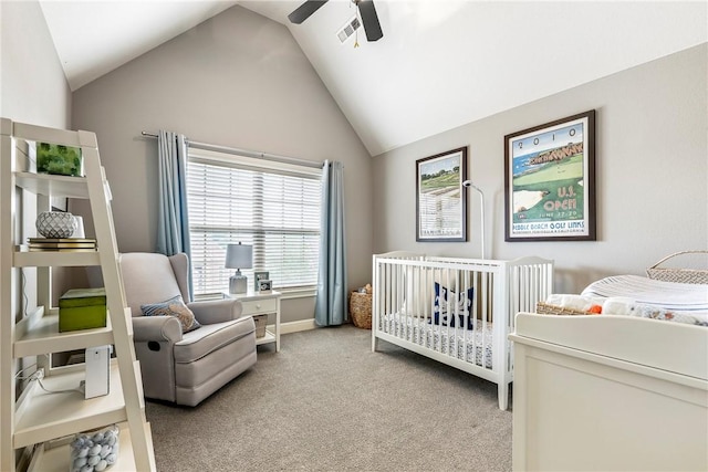 5503 S Turnberry Rd, Rogers, AR 72758 - carpeted bedroom with vaulted ceiling, a crib, and a ceiling fan