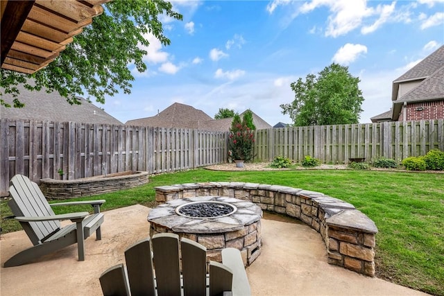 5503 S Turnberry Rd, Rogers, AR 72758 - fenced backyard with an outdoor fire pit and a patio area