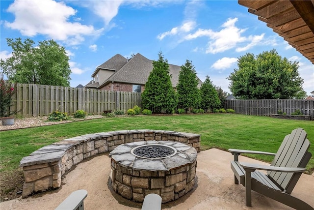 5503 S Turnberry Rd, Rogers, AR 72758 - fenced backyard with an outdoor fire pit and a patio