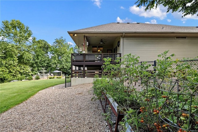 6 Leawood Pl, Bella Vista, AR 72715 - rear view of house with ceiling fan, a yard, a shingled roof, and a deck