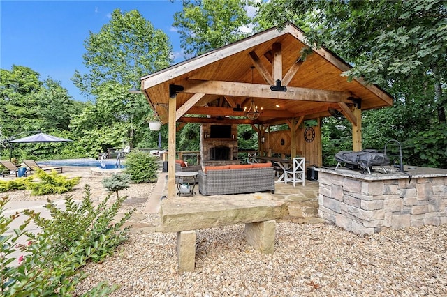 6 Leawood Pl, Bella Vista, AR 72715 - view of patio featuring a gazebo, an outdoor pool, and an outdoor living space with a fireplace