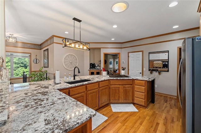 6 Leawood Pl, Bella Vista, AR 72715 - kitchen with stainless steel appliances, light wood-type flooring, light stone countertops, ornamental molding, and recessed lighting