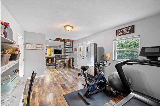 6 Leawood Pl, Bella Vista, AR 72715 - exercise area featuring wood finished floors and a textured ceiling