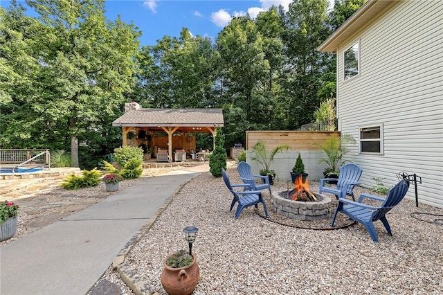6 Leawood Pl, Bella Vista, AR 72715 - view of patio / terrace featuring an outdoor fire pit, a gazebo, and view of scattered trees