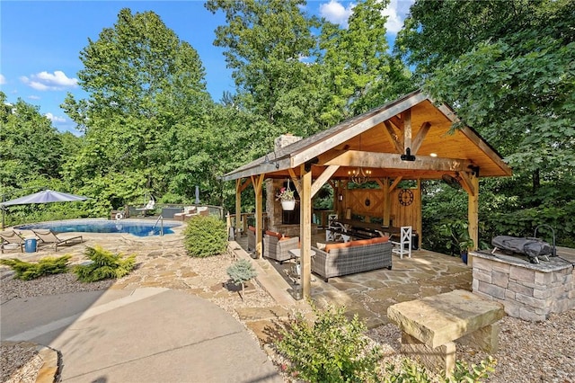 6 Leawood Pl, Bella Vista, AR 72715 - view of patio / terrace featuring a gazebo, an outdoor living space, and an outdoor pool
