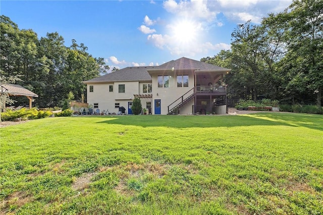 6 Leawood Pl, Bella Vista, AR 72715 - back of property featuring stairway, a lawn, a sunroom, and a deck