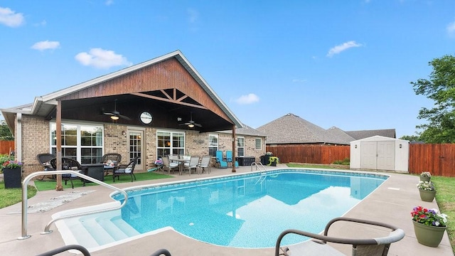 3809 N 2nd Pl, Rogers, AR 72756 - view of pool with a ceiling fan, a storage unit, a fenced backyard, and a patio
