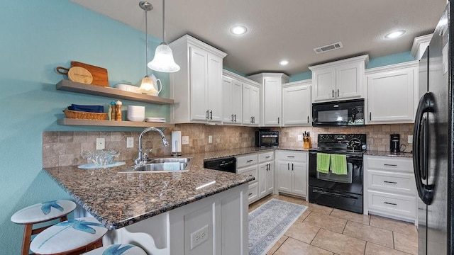 3809 N 2nd Pl, Rogers, AR 72756 - kitchen with black appliances, open shelves, a peninsula, white cabinets, and tasteful backsplash