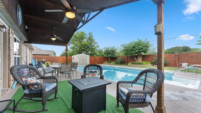 3809 N 2nd Pl, Rogers, AR 72756 - view of pool with a ceiling fan, a fenced backyard, outdoor dining area, a storage unit, and a patio