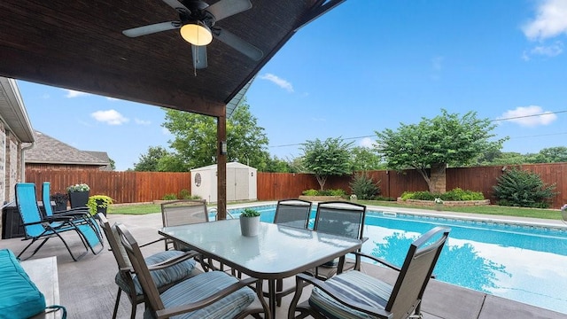 3809 N 2nd Pl, Rogers, AR 72756 - view of pool with a fenced backyard, a storage shed, outdoor dining space, and ceiling fan