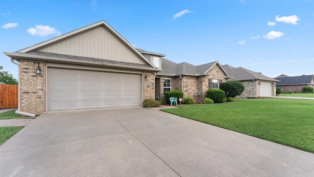 3809 N 2nd Pl, Rogers, AR 72756 - view of front of house featuring brick siding, a front yard, concrete driveway, board and batten siding, and an attached garage