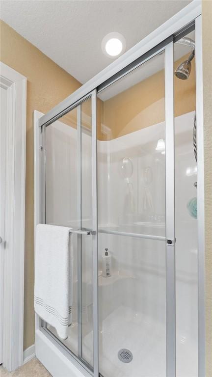 3809 N 2nd Pl, Rogers, AR 72756 - full bathroom with a stall shower