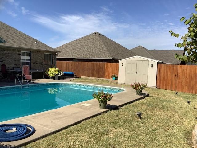 3809 N 2nd Pl, Rogers, AR 72756 - view of pool featuring a storage shed, a fenced backyard, and a patio