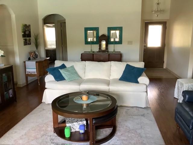 3809 N 2nd Pl, Rogers, AR 72756 - living area featuring arched walkways and wood finished floors