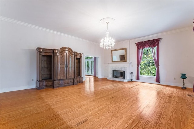 14074 Old Mill Rd, Elkins, AR 72727 - unfurnished living room featuring a chandelier, plenty of natural light, ornamental molding, and wood finished floors
