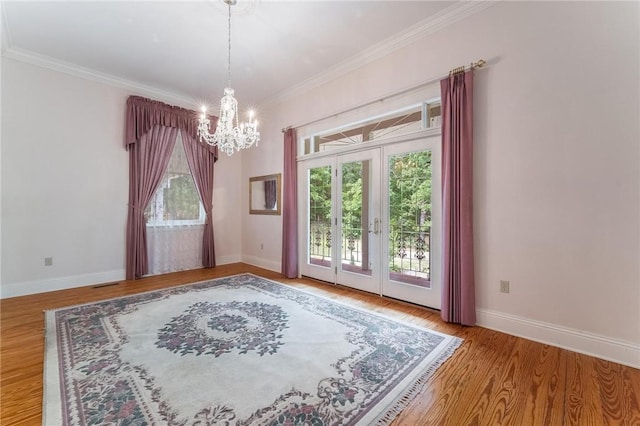 14074 Old Mill Rd, Elkins, AR 72727 - unfurnished room with a chandelier, wood finished floors, and ornamental molding