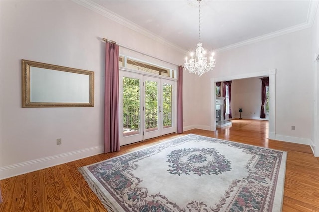 14074 Old Mill Rd, Elkins, AR 72727 - dining area with a chandelier, wood finished floors, and ornamental molding