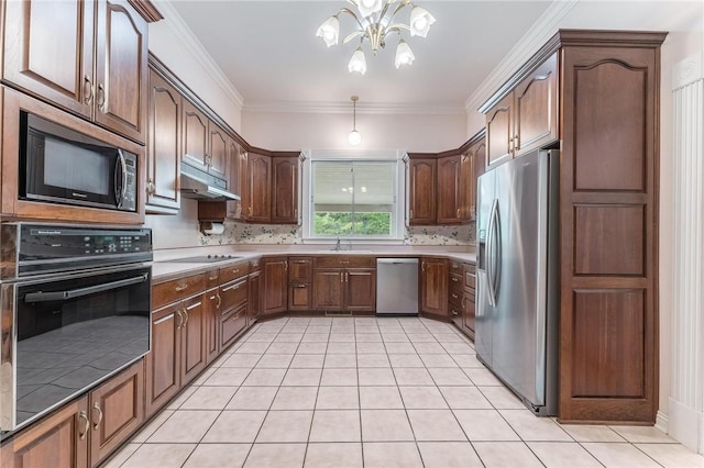 14074 Old Mill Rd, Elkins, AR 72727 - kitchen featuring stainless steel appliances, under cabinet range hood, a chandelier, tasteful backsplash, and light tile patterned flooring