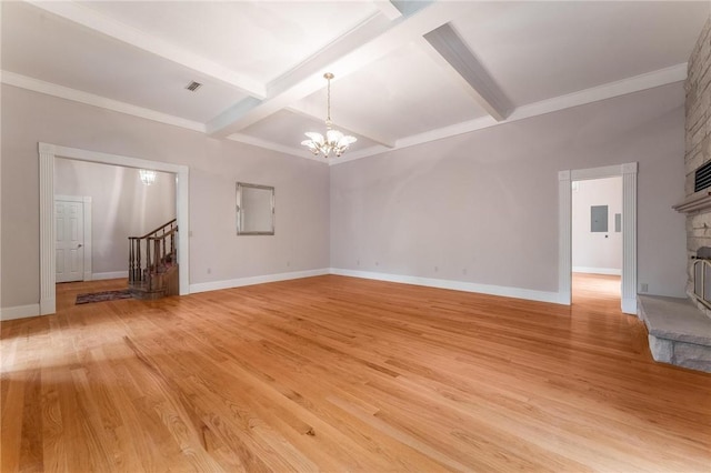 14074 Old Mill Rd, Elkins, AR 72727 - unfurnished room with a chandelier, a large fireplace, beamed ceiling, light wood-style flooring, and stairway