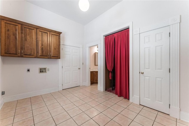 14074 Old Mill Rd, Elkins, AR 72727 - washroom with washer hookup, light tile patterned flooring, cabinet space, and hookup for an electric dryer