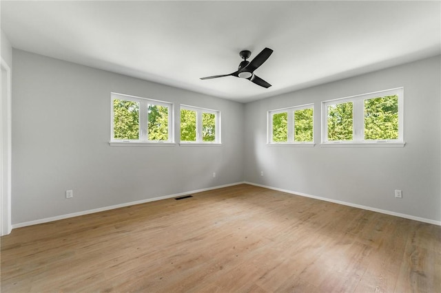 25 Grisham Cir, Bella Vista, AR 72715 - empty room with light wood finished floors and ceiling fan