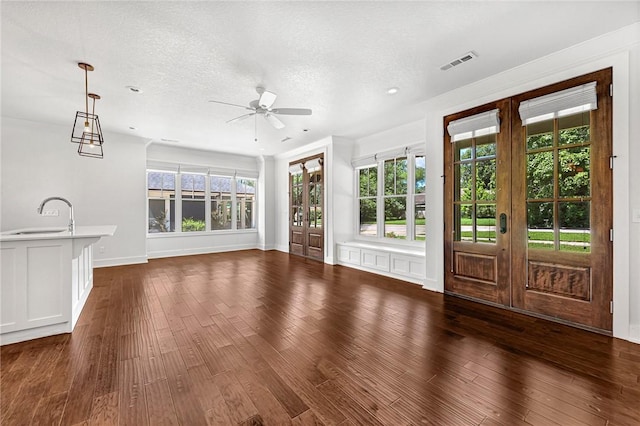 464 Block Ave, Fayetteville, AR 72701 - unfurnished living room with french doors, ceiling fan, dark wood-type flooring, recessed lighting, and a textured ceiling