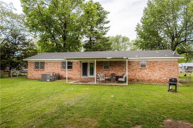 805 S Oak Hill St, Siloam Springs, AR 72761 - rear view of property with a patio and brick siding