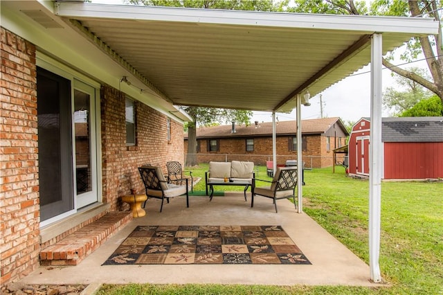 805 S Oak Hill St, Siloam Springs, AR 72761 - view of patio featuring a shed and an outdoor living space