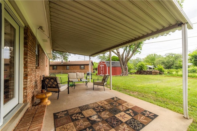 805 S Oak Hill St, Siloam Springs, AR 72761 - view of patio / terrace featuring a storage unit and an outdoor living space