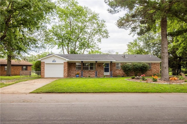 805 S Oak Hill St, Siloam Springs, AR 72761 - view of front of home with concrete driveway, brick siding, a garage, and a front yard