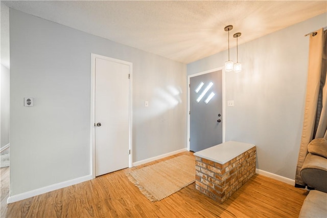 805 S Oak Hill St, Siloam Springs, AR 72761 - foyer featuring light wood-style floors and baseboards