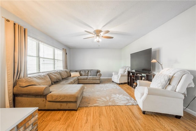 805 S Oak Hill St, Siloam Springs, AR 72761 - living area featuring ceiling fan and wood finished floors