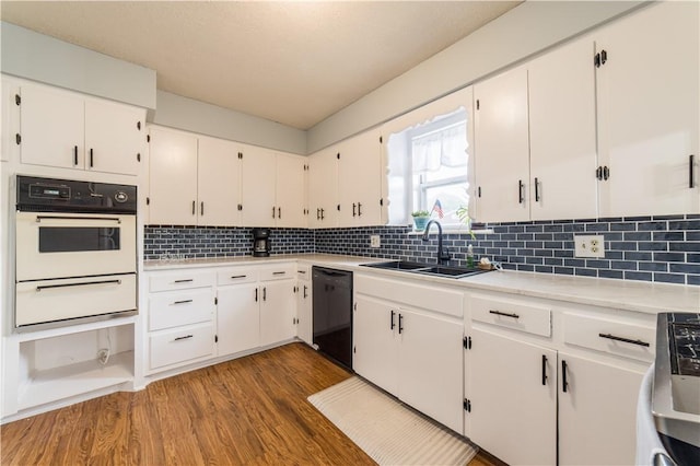 805 S Oak Hill St, Siloam Springs, AR 72761 - kitchen featuring white oven, a warming drawer, dishwasher, stove, and wood finished floors