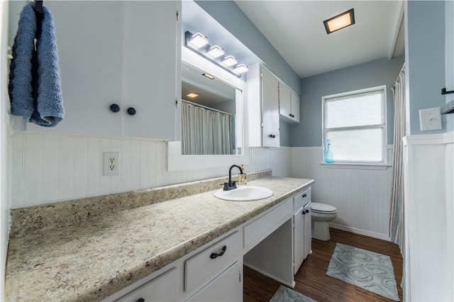 805 S Oak Hill St, Siloam Springs, AR 72761 - bathroom with a wainscoted wall, vanity, and wood finished floors