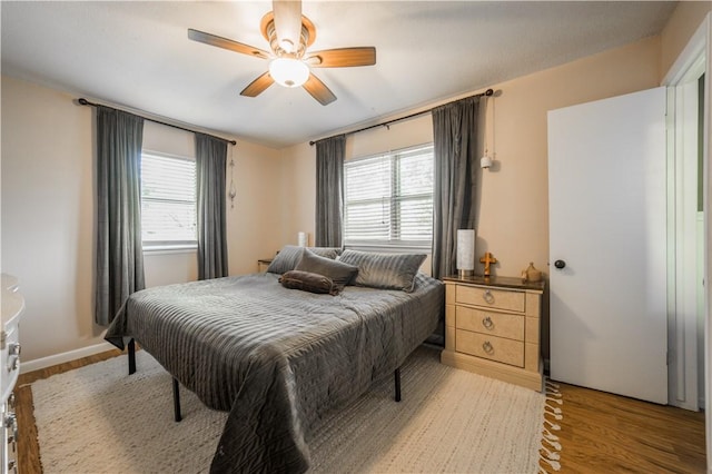 805 S Oak Hill St, Siloam Springs, AR 72761 - bedroom with light wood-style floors and a ceiling fan
