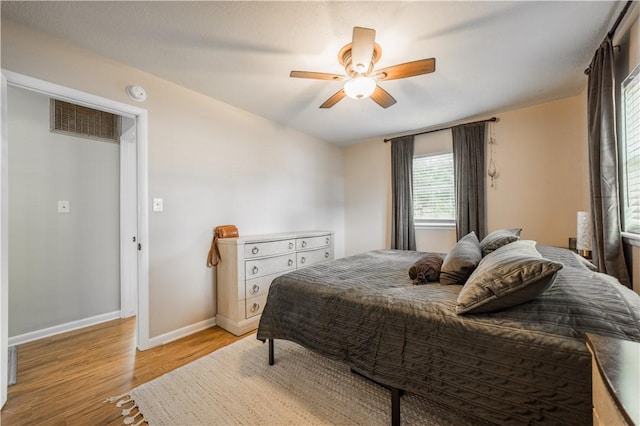 805 S Oak Hill St, Siloam Springs, AR 72761 - bedroom featuring light wood finished floors and ceiling fan