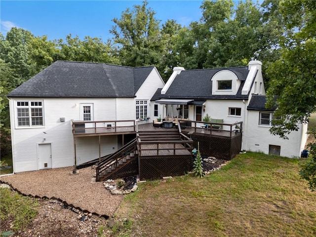 393 Timberlake Ln, Eureka Springs, AR 72631 - rear view of house with a deck, a lawn, a shingled roof, and stairway