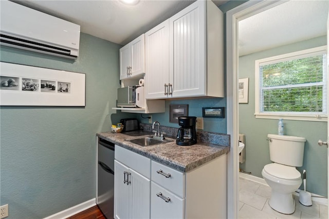 393 Timberlake Ln, Eureka Springs, AR 72631 - kitchen featuring a wall mounted air conditioner, dishwasher, and white cabinets