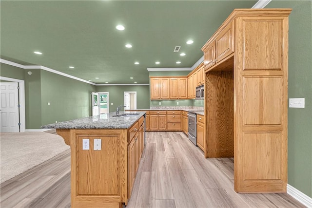 141 Hawn Ave, Huntsville, AR 72738 - kitchen featuring appliances with stainless steel finishes, ornamental molding, a kitchen island with sink, recessed lighting, and light wood-type flooring