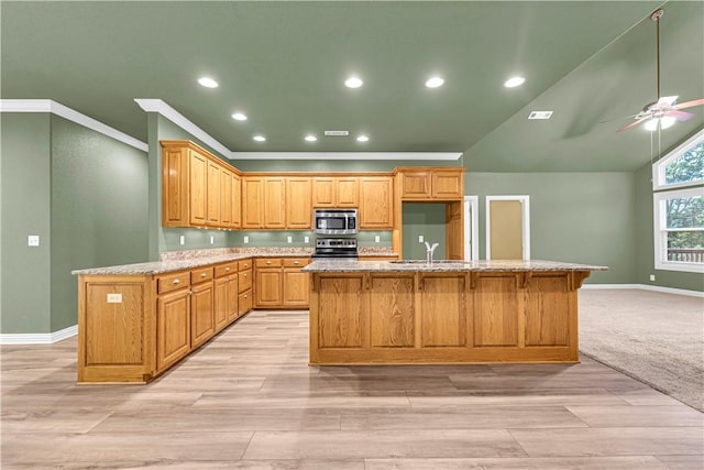141 Hawn Ave, Huntsville, AR 72738 - kitchen featuring stainless steel appliances, a ceiling fan, a kitchen island with sink, ornamental molding, and light stone counters