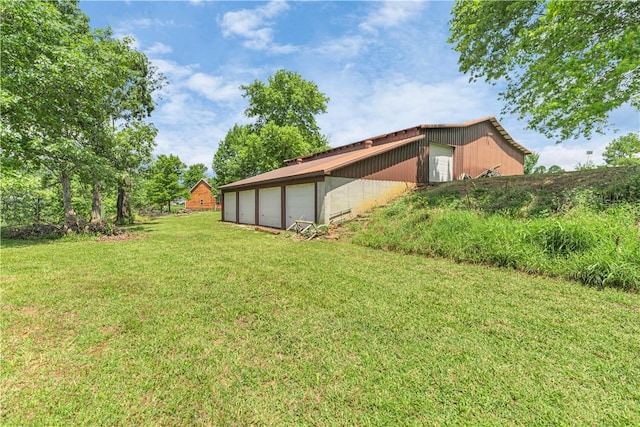 141 Hawn Ave, Huntsville, AR 72738 - view of grassy yard featuring an outdoor structure, a garage, and a pole building