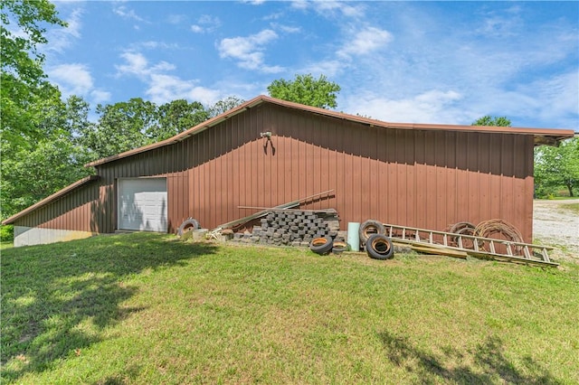 141 Hawn Ave, Huntsville, AR 72738 - view of home's exterior featuring a yard, an outbuilding, and board and batten siding
