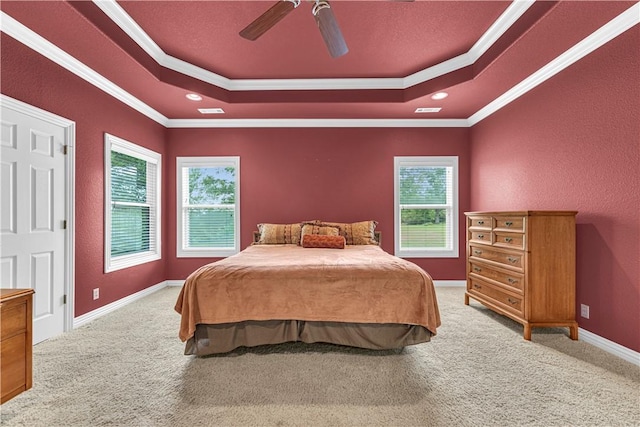 141 Hawn Ave, Huntsville, AR 72738 - carpeted bedroom with a raised ceiling, multiple windows, ornamental molding, a ceiling fan, and a textured wall