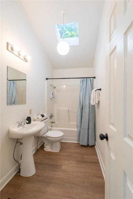 21271 Maple Dr, Garfield, AR 72732 - full bathroom with a skylight, lofted ceiling, shower / bath combination with curtain, and wood finished floors