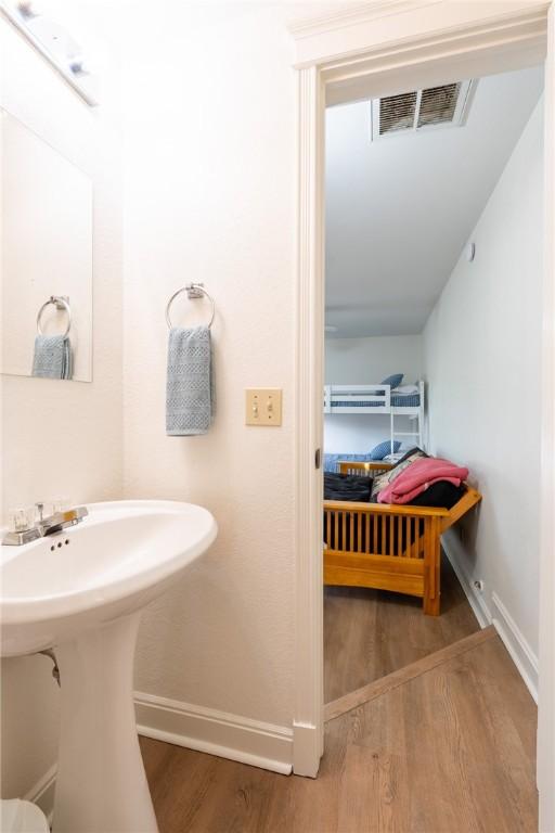 21271 Maple Dr, Garfield, AR 72732 - bathroom with wood finished floors and baseboards