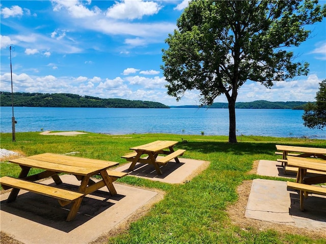 21271 Maple Dr, Garfield, AR 72732 - view of community featuring a water view, a yard, and a patio